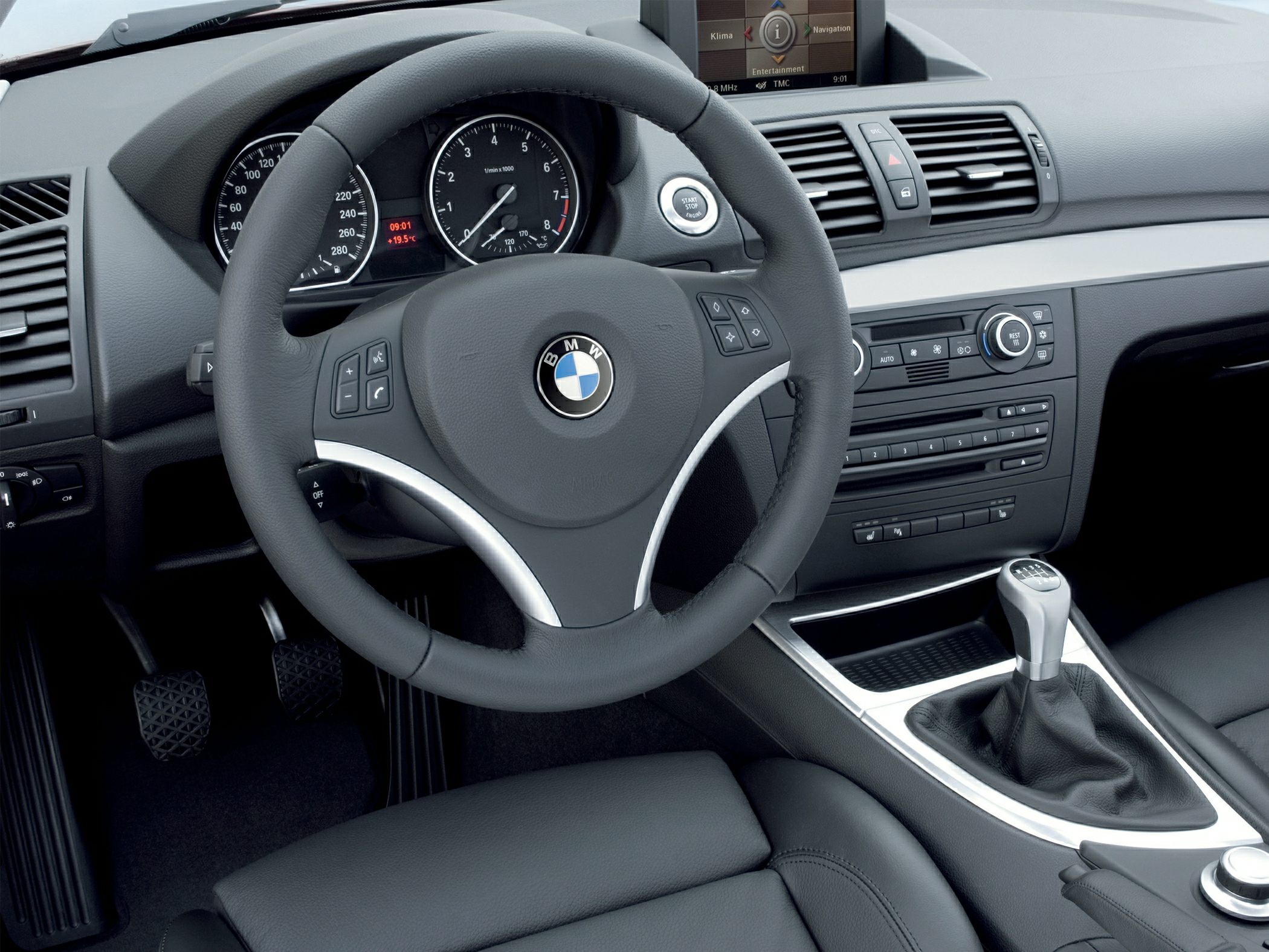 BMW steering wheel, dashboard, and manual gear shift interior