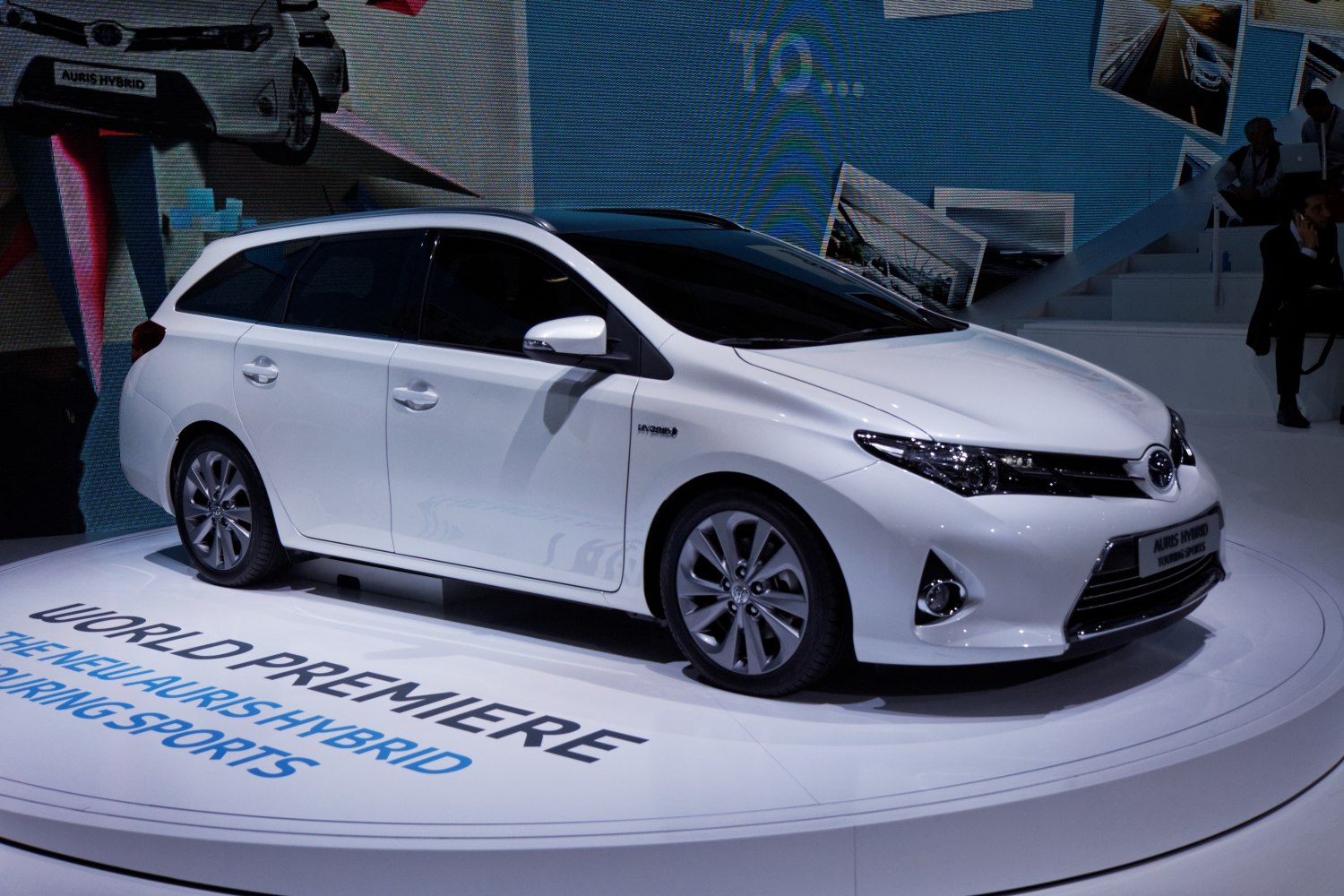 White hybrid station wagon with sleek modern design and alloy wheels
