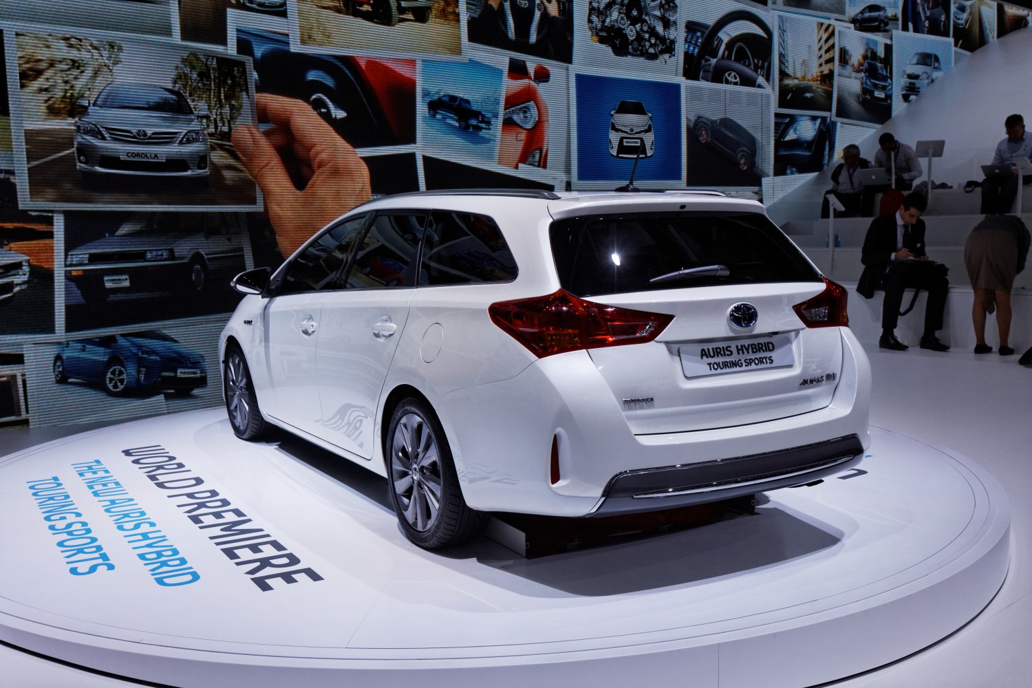 Rear view of white hybrid touring sports station wagon