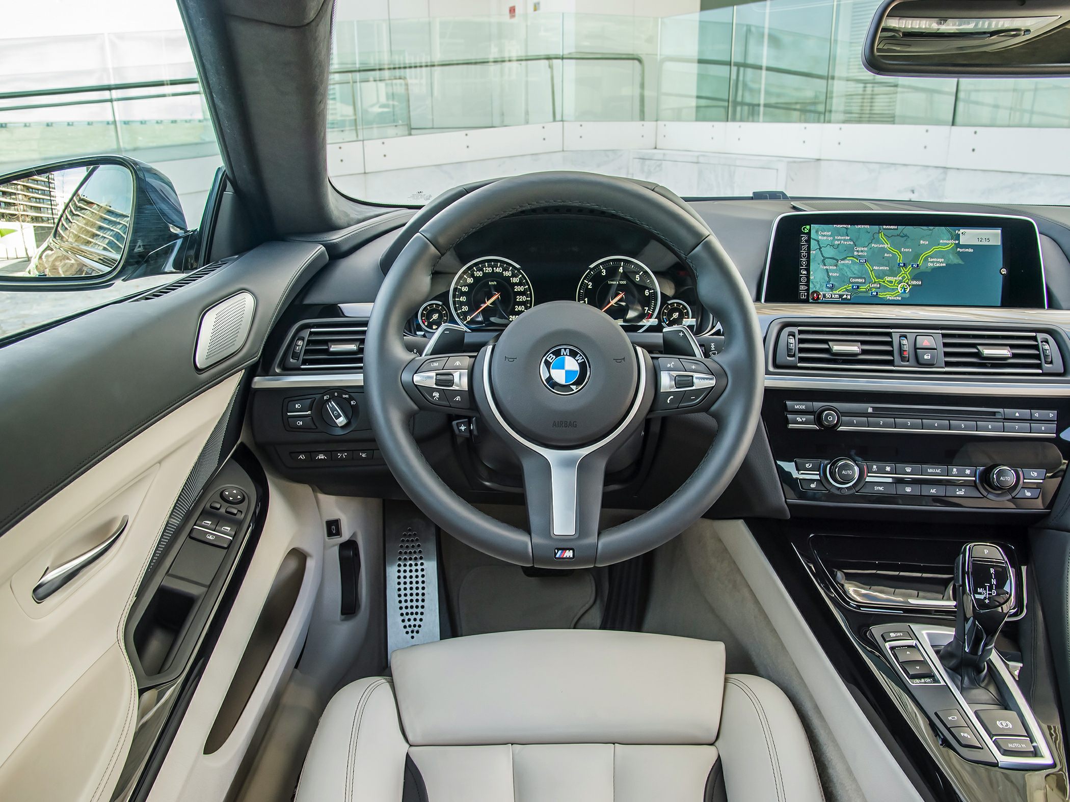 Luxury interior with detailed steering wheel and advanced dashboard