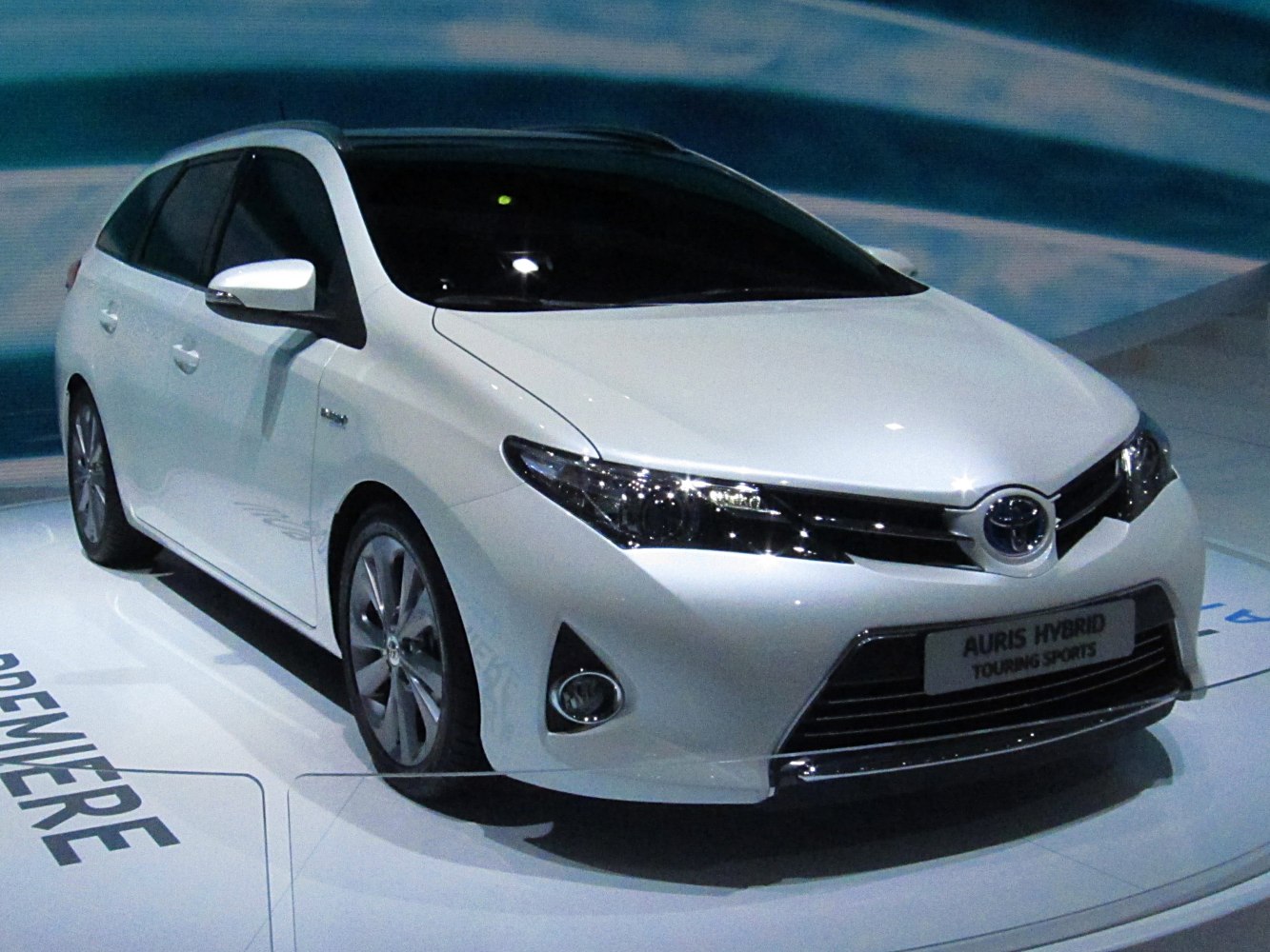 Hybrid compact wagon front view with sleek headlights and sporty front grille