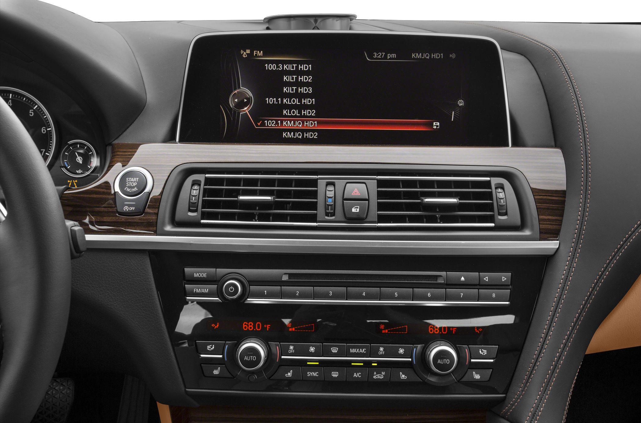 BMW dashboard with infotainment screen and dual-zone climate controls