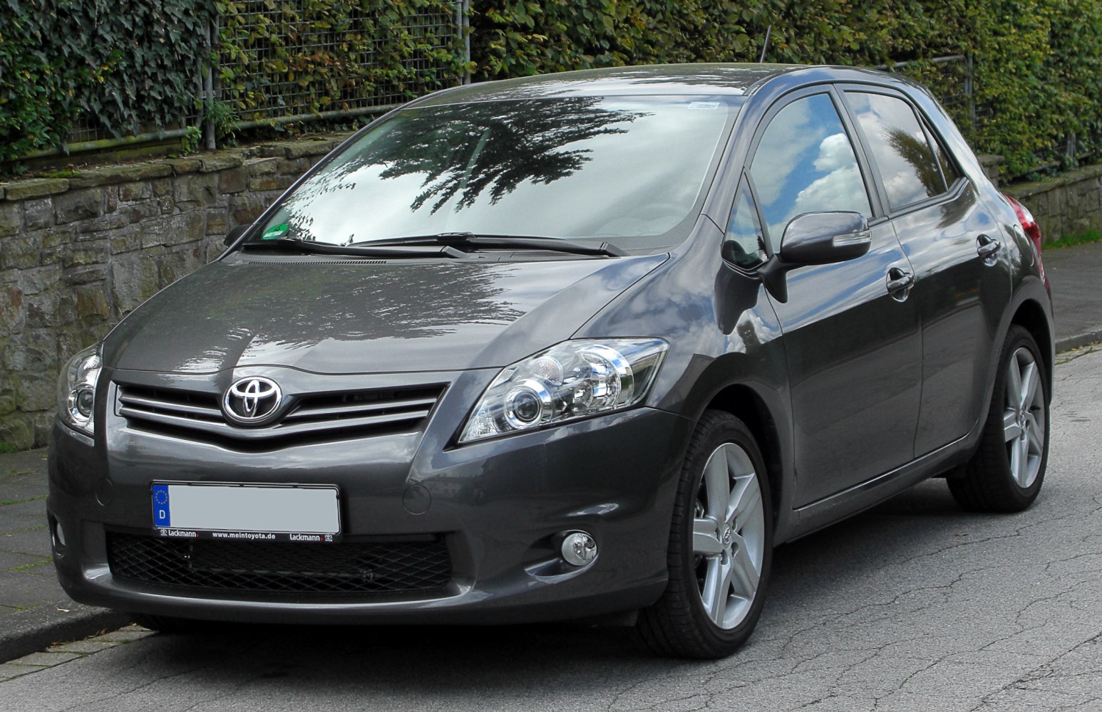 Front view with headlights, grille, alloy wheels of a hatchback