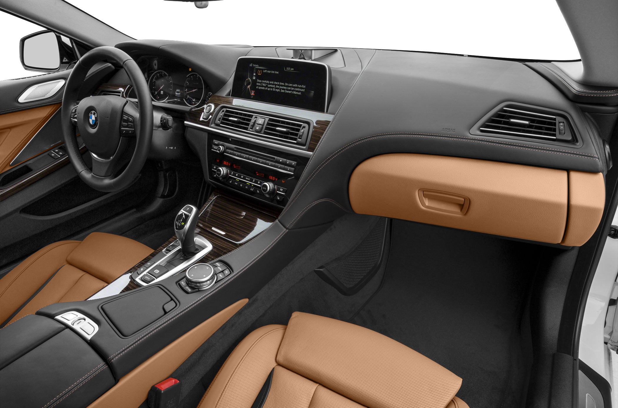 Luxurious tan leather seats with modern dashboard and center console controls