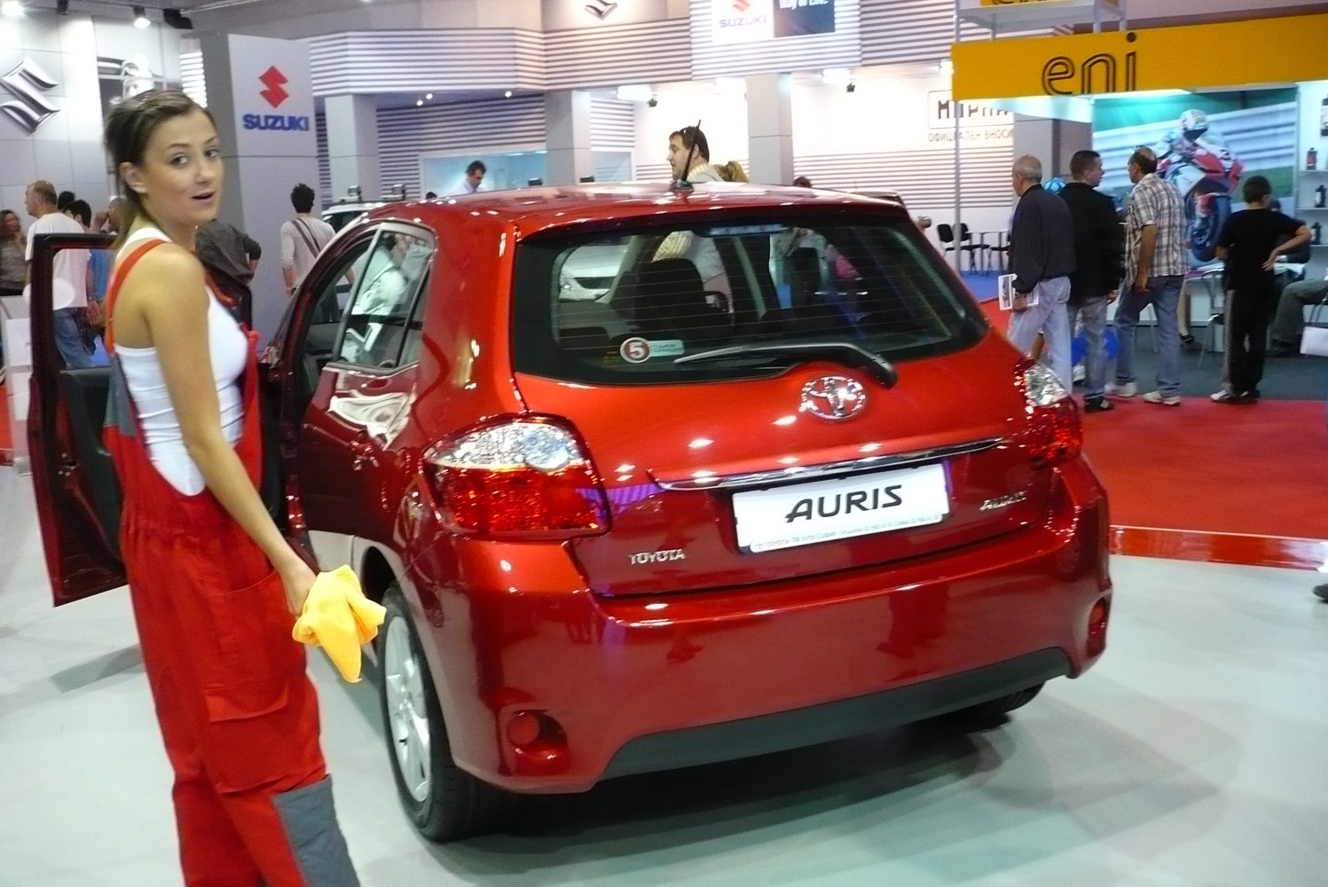 Red hatchback rear view with taillights and rear windshield wiper