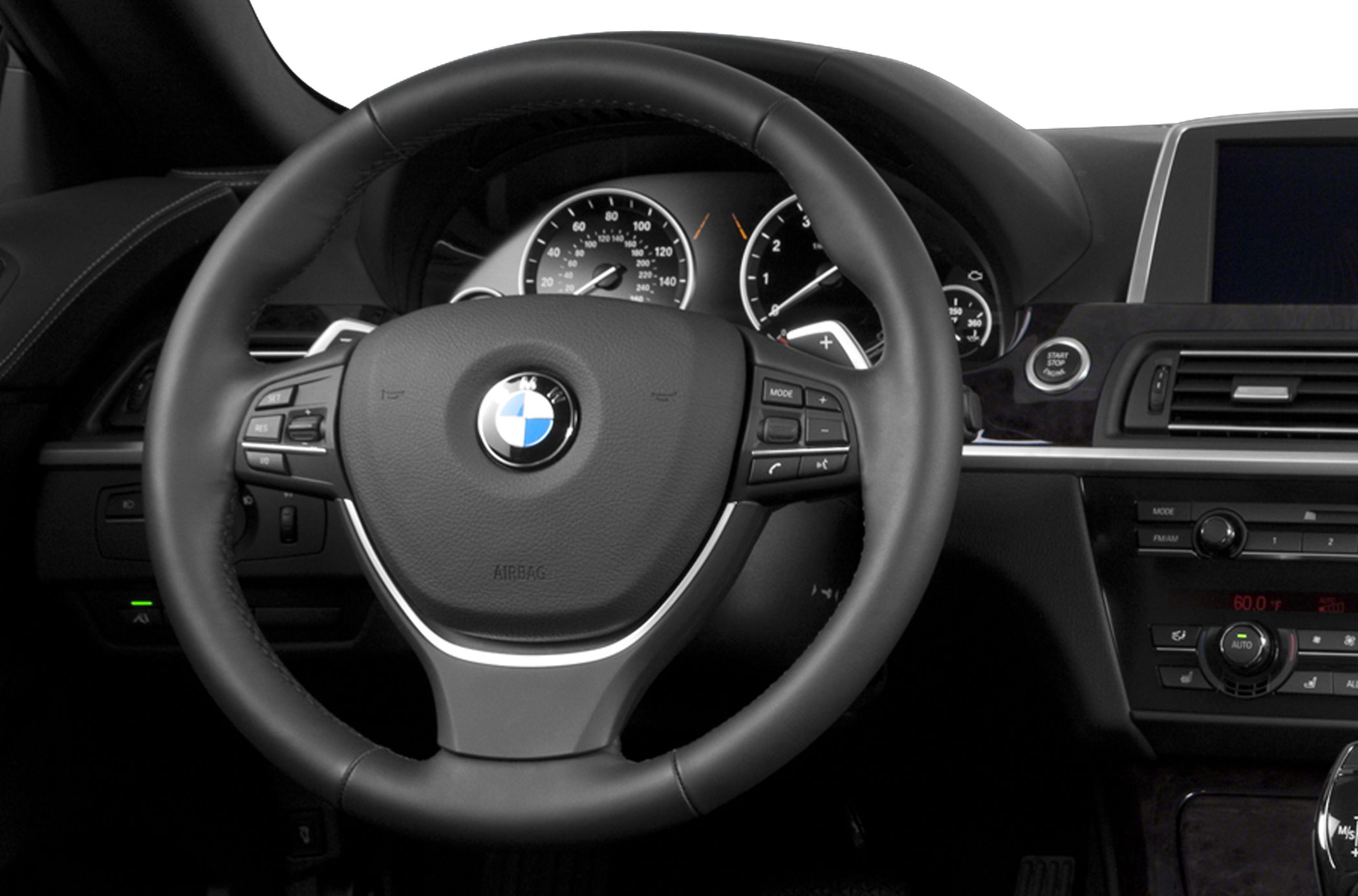 Steering wheel with control buttons and dashboard instrument cluster
