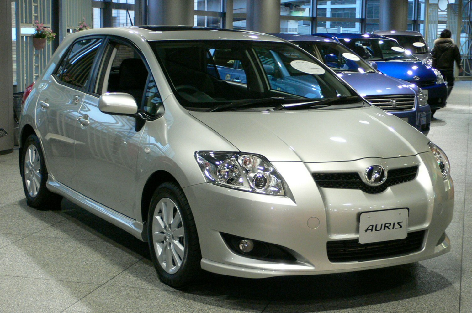 Compact hatchback with projector headlights and alloy wheels.