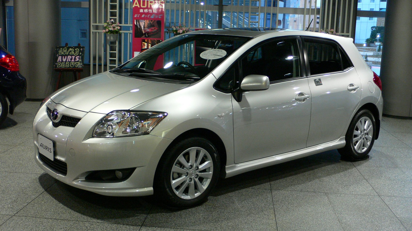 Silver hatchback front and side profile with detailed headlights and alloy wheels