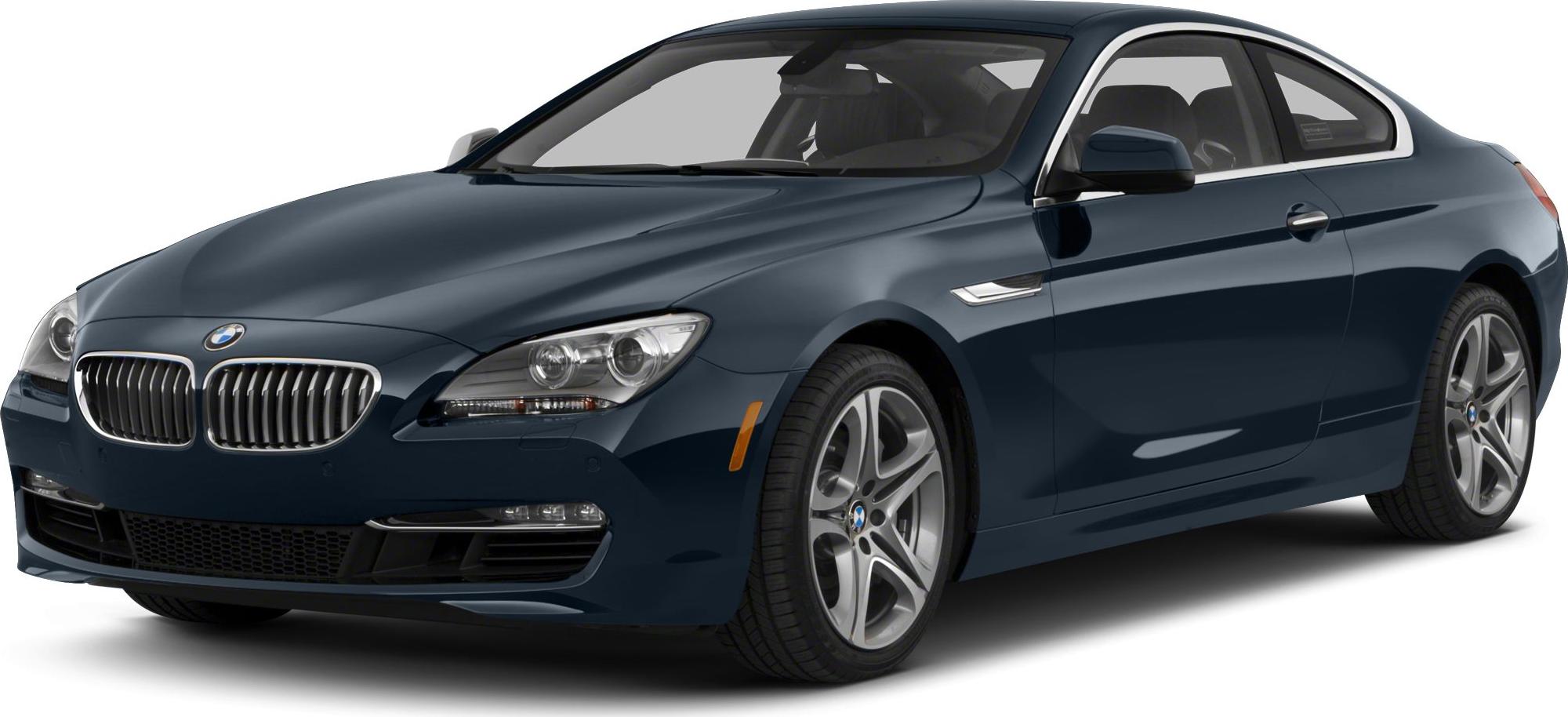 Front view of a blue luxury coupe with kidney grille and alloy wheels