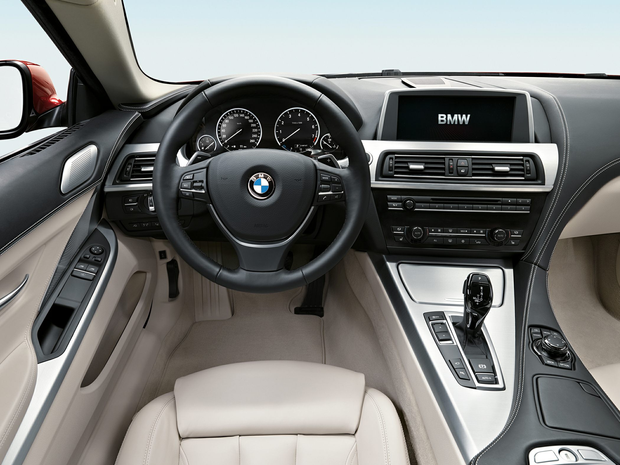 Interior dashboard and multifunction steering wheel with gear lever and infotainment controls
