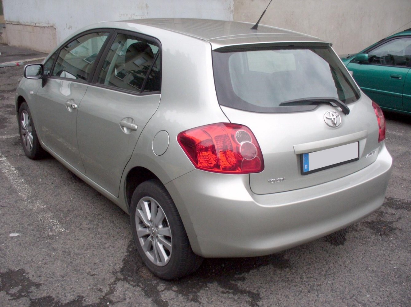 Silver compact hatchback rear and side view with distinct tail lights