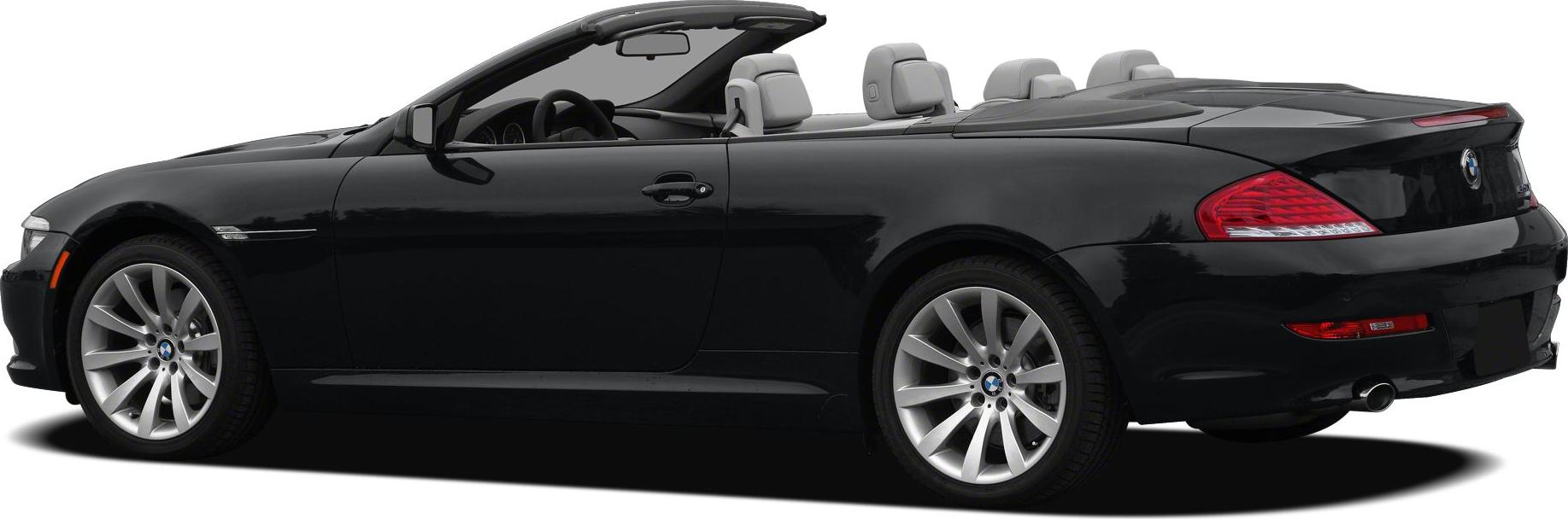 Side profile of black BMW convertible with open roof and alloy wheels