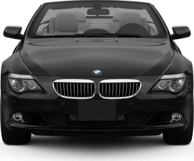 Front view of a black convertible with kidney grille and modern headlights