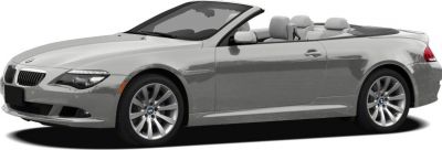 Silver convertible two-door coupe with soft top and alloy wheels