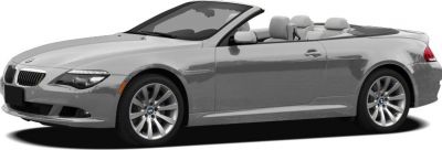 Silver two-door convertible roadster with sleek design and alloy wheels.