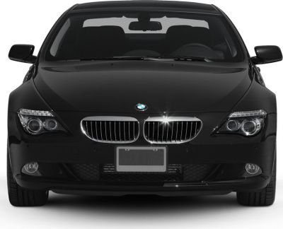Front view featuring kidney grille and headlights of a luxury coupe.