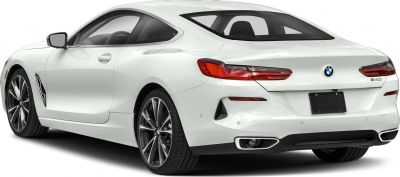 Rear and side profile of a sporty luxury coupe with alloy wheels and sharp taillights.