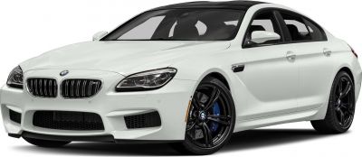 Front-side view of white luxury coupe with black alloy wheels and sporty front design