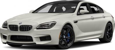 Front angle with aggressive grille and black alloy wheels