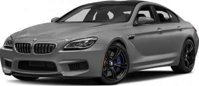 Front-side view of a sleek luxury coupe with black alloy wheels and blue brake calipers