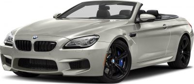 Front grille and black alloy wheel with blue brake caliper on a convertible