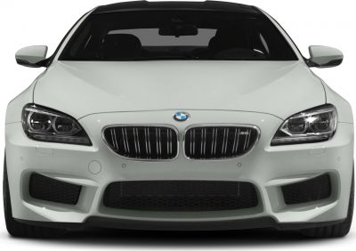 Front view of a luxury sedan with kidney grille and aggressive headlights.