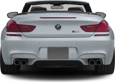 Rear view with quad exhaust and taillights of a convertible