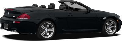 Rear side view of convertible with open roof and quad exhaust
