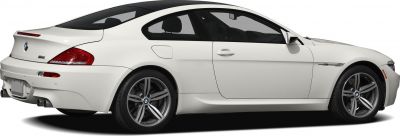 Side and rear view of a white BMW coupe with alloy wheels and quad exhaust