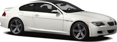 Side profile of white sporty coupe with alloy wheels and sleek design