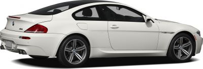 White coupe side profile with signature alloy wheels and aerodynamic shape