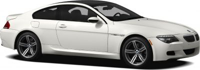 Side profile of white coupe with alloy wheels and sleek aerodynamic body