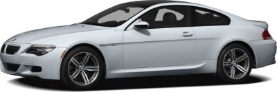 White coupe side profile with alloy wheels and aerodynamic shape.