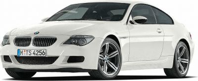White coupe with twin headlights and alloy wheels