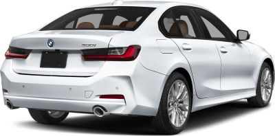 Rear view of a white luxury sedan with dual exhausts and modern taillights