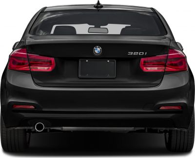 Rear view with taillights and single exhaust on black sedan
