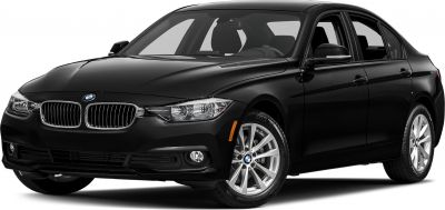 Front side view of black sedan with signature grille and headlights