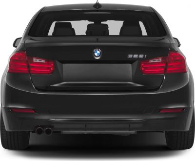 Black sedan rear view with dual exhaust and red taillights