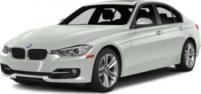 Front-side view of sedan with distinctive headlights and grille