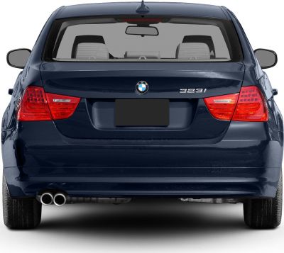 Rear view showcasing tail lights and dual exhaust of a sedan.