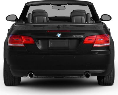 Rear view of convertible with dual exhaust and taillights.