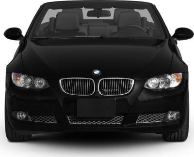 Front view of a black convertible featuring kidney grille and dual headlights