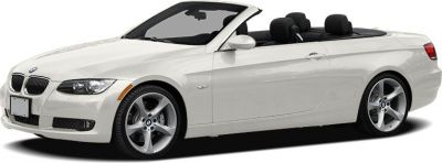 White luxury convertible with open soft top and alloy wheels
