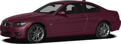 Side profile of a sleek two-door coupe with alloy wheels