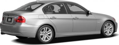 Side and rear view of a sedan with alloy wheels and rear lights.