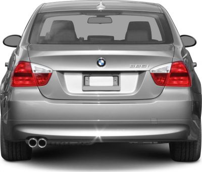 Rear view of BMW 3 Series sedan with dual exhaust and taillights