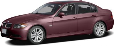 Side profile of a maroon four-door sedan with alloy wheels