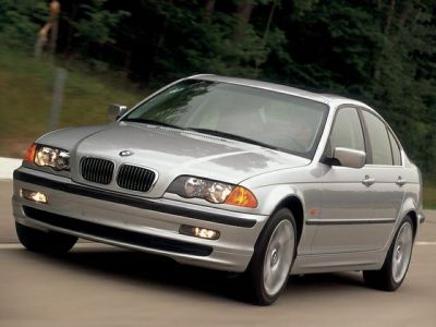 Silver sedan front view with kidney grille and clear headlights