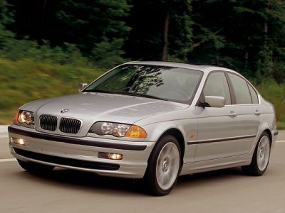 Front view of silver sedan with kidney grille and headlights