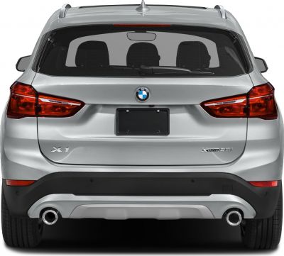 Rear view with dual exhaust pipes and taillights